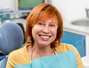 Older female patient smiling in dental chair