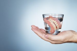 dentures in glass of water